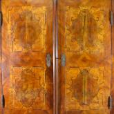 Detail of inlaid doors of baroque wardrobe (before restoration)